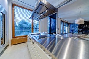 Modern kitchen interior with stainless steel sink and appliances