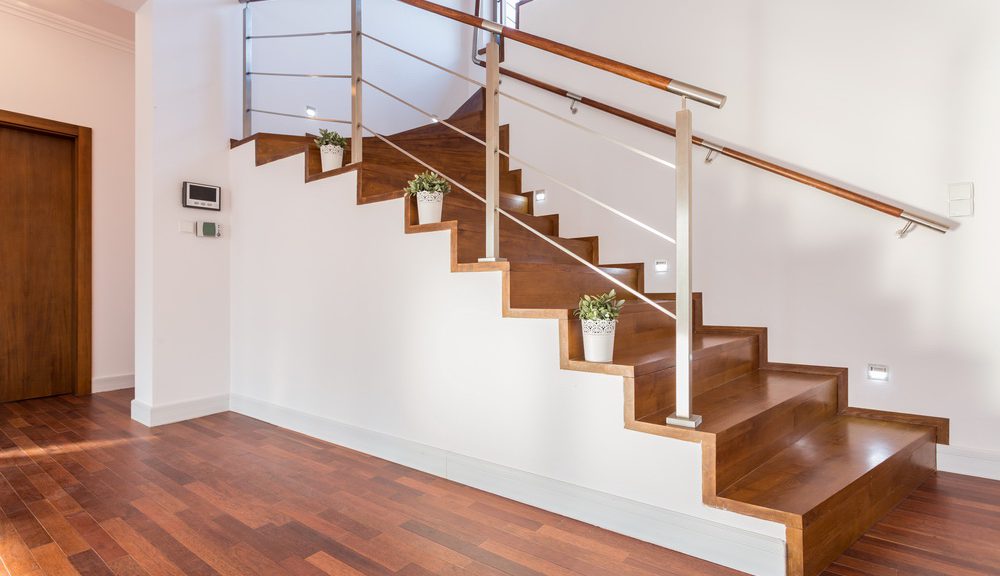 Flowerpots situated on wooden stairs