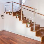 Flowerpots situated on wooden stairs