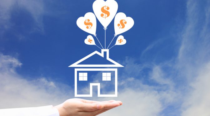Female hands holding symbol of house with balloon and symbol of dollar on blue sky background, Save money for prepare in future and Banking concept