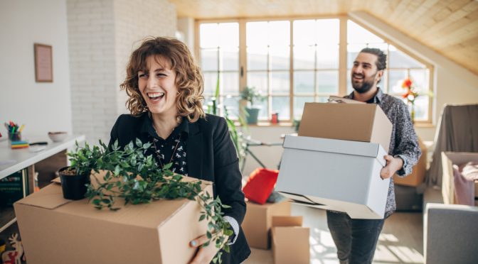 Couple moving in into new apartment