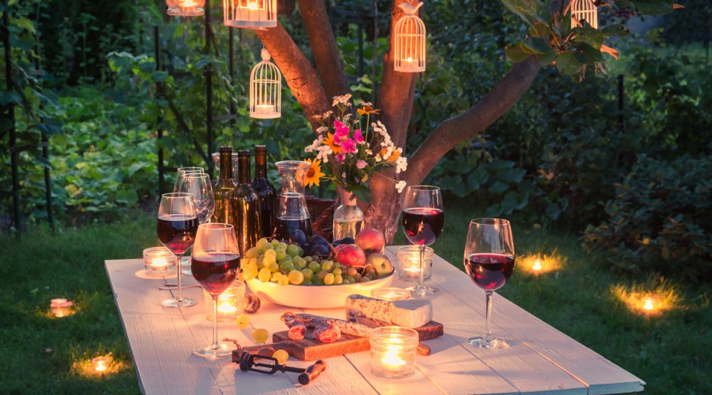 Beautiful table full of cheese and meats in garden