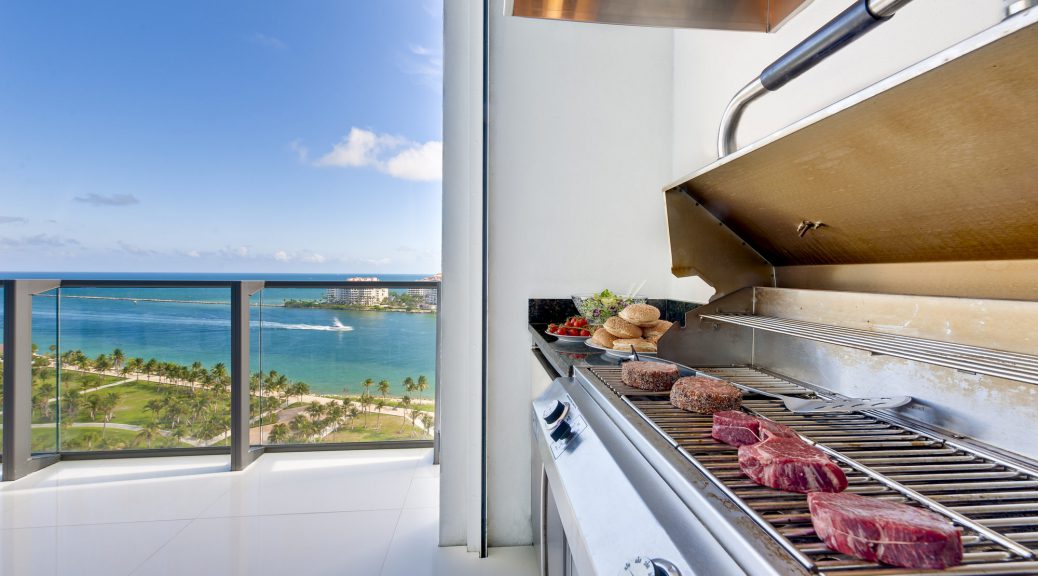 View of a barbecue in an luxury terrace with ocean view.