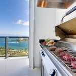 View of a barbecue in an luxury terrace with ocean view.