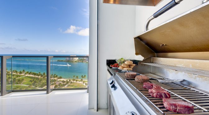 View of a barbecue in an luxury terrace with ocean view.