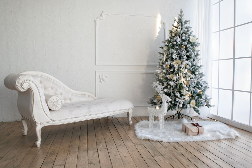 Christmas tree with presents underneath in living room